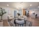Cozy living room featuring stylish furniture, a modern light fixture, and hardwood floors at 8215 E Virginia Ave, Scottsdale, AZ 85257