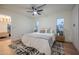 Bright main bedroom features a ceiling fan, wood floors, and a neutral color scheme at 8215 E Virginia Ave, Scottsdale, AZ 85257