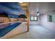 Outdoor patio with a ceiling fan that overlooks a pool, the patio is perfect for outdoor entertainment at 8215 E Virginia Ave, Scottsdale, AZ 85257