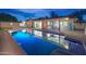 Inviting pool and patio area, perfect for outdoor entertaining and relaxation at twilight at 8215 E Virginia Ave, Scottsdale, AZ 85257