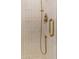 Shower is finished with gold hardware and a handheld sprayer at 8215 E Virginia Ave, Scottsdale, AZ 85257