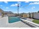 Sparkling in-ground swimming pool with diving board and pristine concrete patio at 8215 E Virginia Ave, Scottsdale, AZ 85257