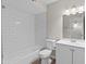 Bathroom featuring subway tile shower/tub, vanity, and modern fixtures at 1112 W Farmdale Ave, Mesa, AZ 85210