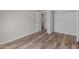 Clean bedroom with wood-look floors and a closet perfect for organization at 1112 W Farmdale Ave, Mesa, AZ 85210