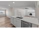 Kitchen view from island, showing stainless dishwasher, fireplace and lots of room at 1112 W Farmdale Ave, Mesa, AZ 85210
