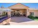 Covered patio with a view of an outdoor kitchen and landscaped yard at 11224 E Carol Ave, Scottsdale, AZ 85259
