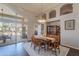 Dining area with backyard access, and decorative cabinetry at 11224 E Carol Ave, Scottsdale, AZ 85259