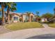 Charming home featuring desert landscaping, a paver walkway, and a beige exterior at 11224 E Carol Ave, Scottsdale, AZ 85259