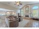 Inviting living room with neutral tones, fireplace, and open access to the kitchen at 11224 E Carol Ave, Scottsdale, AZ 85259