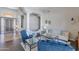 Spacious living room with hardwood flooring, decorative columns, and comfortable seating arrangements at 11224 E Carol Ave, Scottsdale, AZ 85259