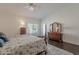 Bright main bedroom with a patterned bedspread, wood flooring, and lots of natural light at 11224 E Carol Ave, Scottsdale, AZ 85259