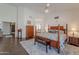 Spacious main bedroom with a four-poster bed, sitting area, and ensuite bathroom access at 11224 E Carol Ave, Scottsdale, AZ 85259