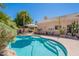 Backyard swimming pool with steps, outdoor seating, and mature landscaping at 11224 E Carol Ave, Scottsdale, AZ 85259