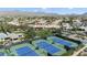 Aerial view of tennis and pickleball courts in desirable 55+ active adult community surrounded by mountain views at 11224 E Carol Ave, Scottsdale, AZ 85259