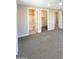 Large bedroom leads to bathroom and closet with carpeted floors at 11663 W Luxton Ln, Avondale, AZ 85323