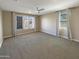 Spacious bedroom featuring a ceiling fan and large windows with plenty of natural light at 11663 W Luxton Ln, Avondale, AZ 85323