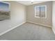 Bedroom with carpet flooring, neutral walls and bright windows with blinds at 11663 W Luxton Ln, Avondale, AZ 85323