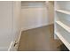 Walk-in closet features shelving for optimal organization and storage space at 11663 W Luxton Ln, Avondale, AZ 85323