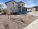Attractive home exterior with a three-car garage and well-maintained landscaping at 11663 W Luxton Ln, Avondale, AZ 85323