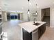 Open-concept kitchen features a center island and leads to living space at 11663 W Luxton Ln, Avondale, AZ 85323