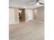 Open-concept living room features tile flooring and entry to kitchen at 11663 W Luxton Ln, Avondale, AZ 85323