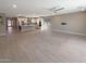 Spacious open-concept living area flows into a modern kitchen with stainless steel appliances at 11663 W Luxton Ln, Avondale, AZ 85323