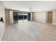 Spacious living room with sliding glass doors leading to backyard and tile floor at 11663 W Luxton Ln, Avondale, AZ 85323
