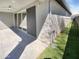 Covered patio with tile flooring, sliding glass doors, and view to backyard at 11663 W Luxton Ln, Avondale, AZ 85323