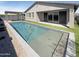 Beautiful backyard pool with modern design and lush landscaping, perfect for relaxation and entertainment at 11663 W Luxton Ln, Avondale, AZ 85323