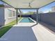 Covered patio with a clear view of the sparkling backyard pool and landscaping at 11663 W Luxton Ln, Avondale, AZ 85323