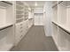 Walk-in closet with custom shelving, drawers, and hanging space at 11663 W Luxton Ln, Avondale, AZ 85323