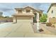 Inviting two-story home with a well-maintained yard and two car garage at 15454 W Evans Dr, Surprise, AZ 85379
