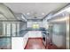 Well-lit kitchen boasts granite countertops, white cabinets, and stainless steel appliances at 1556 E Dover Cir, Mesa, AZ 85203
