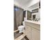 Bathroom featuring a vanity, neutral tile flooring, and shower-tub combo at 15814 N 62Nd Cir, Glendale, AZ 85306