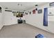 Carpeted bonus room with sports memorabilia, offering flexible space for entertainment or hobbies at 15814 N 62Nd Cir, Glendale, AZ 85306