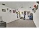 Versatile carpeted bonus room offering ample space for various activities and decor at 15814 N 62Nd Cir, Glendale, AZ 85306