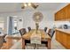 Bright dining space with a decorative mirror, perfect for Gathering meals at 15814 N 62Nd Cir, Glendale, AZ 85306