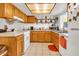 Charming kitchen with wooden cabinets, ample counter space, and modern appliances at 15814 N 62Nd Cir, Glendale, AZ 85306