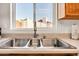 Functional kitchen sink area with natural light, offering a practical workspace at 15814 N 62Nd Cir, Glendale, AZ 85306