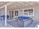 Covered patio with outdoor seating, BBQ grill, and stylish patterned rug at 15814 N 62Nd Cir, Glendale, AZ 85306