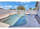 Backyard pool features clear blue water and a rock waterfall feature for a tranquil backyard at 15814 N 62Nd Cir, Glendale, AZ 85306