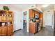 Kitchen with stainless steel appliances, tile backsplash, and wood cabinets at 17885 N 99Th Dr, Sun City, AZ 85373
