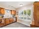 Bright kitchen with granite countertops and custom-painted dishwasher at 17885 N 99Th Dr, Sun City, AZ 85373