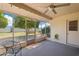 Enclosed sunroom with natural light and relaxing atmosphere offers views of the landscaped backyard at 17885 N 99Th Dr, Sun City, AZ 85373