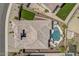 Aerial shot of a private residence showing a tiled roof, backyard pool, outdoor seating, and manicured desert landscaping at 18120 W Cassia Way, Goodyear, AZ 85338