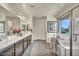 The main bathroom features dual sinks, a soaking tub and a glass enclosed shower at 18120 W Cassia Way, Goodyear, AZ 85338