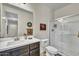 Well-lit bathroom featuring a vanity with drawers and cabinets, along with a walk-in shower for convenience at 18120 W Cassia Way, Goodyear, AZ 85338