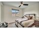 Comfortable bedroom with a window and bedside table at 18120 W Cassia Way, Goodyear, AZ 85338