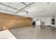 Spacious three car garage with epoxy floors and built-in storage cabinets, offering ample parking at 18120 W Cassia Way, Goodyear, AZ 85338
