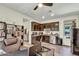 View of office space with kitchenette, featuring dark wood cabinets and essential appliances at 18120 W Cassia Way, Goodyear, AZ 85338